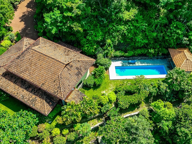 Aerial view of Finca Bosquemar, showcasing the harmony of nature and ocean views in a luxurious beachfront property setting
