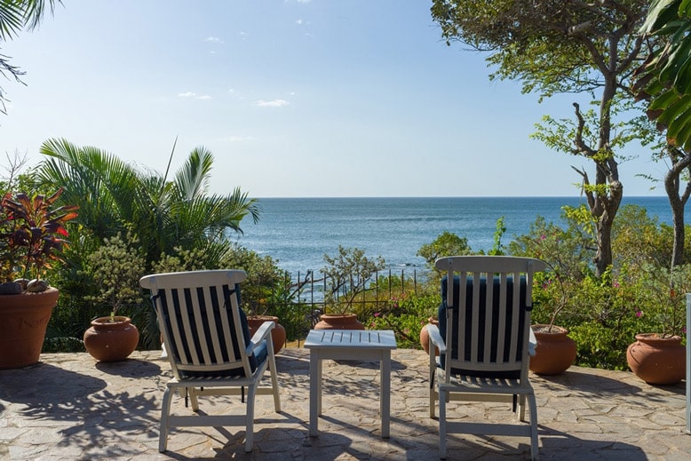Relaxing seaside retreat with a view of Tamarindo Beach Costa Rica, showcasing comfort and style