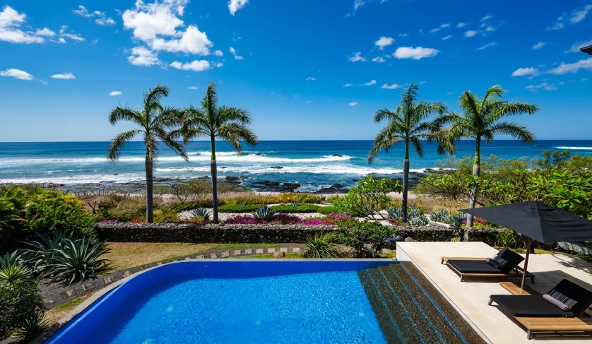Luxurious poolside view with ocean front at Playa Negra Homes for Sale